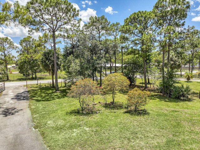 11033 67th Pl N, The Acreage, FL 33412 - surrounding community with a lawn