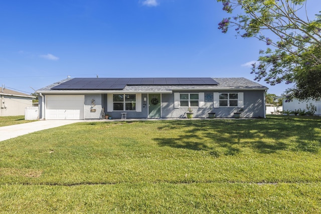 149 SW Grimaldo Ter, Port Saint Lucie, FL 34984 - single story home with an attached garage, driveway, a front yard, stucco siding, and roof mounted solar panels