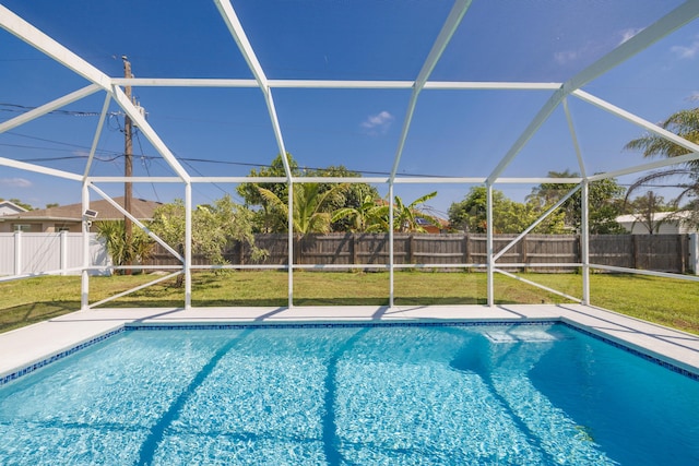 149 SW Grimaldo Ter, Port Saint Lucie, FL 34984 - view of swimming pool with glass enclosure and a patio area