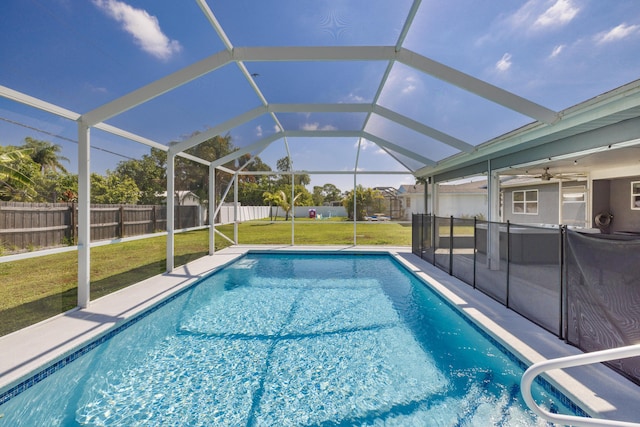 149 SW Grimaldo Ter, Port Saint Lucie, FL 34984 - view of pool featuring a ceiling fan, glass enclosure, and a patio area