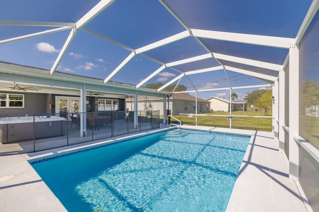149 SW Grimaldo Ter, Port Saint Lucie, FL 34984 - outdoor pool featuring a ceiling fan, a patio, french doors, and a lanai