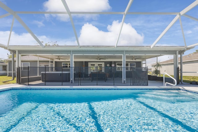 149 SW Grimaldo Ter, Port Saint Lucie, FL 34984 - swimming pool featuring a ceiling fan, an outdoor hangout area, a patio area, and a lanai