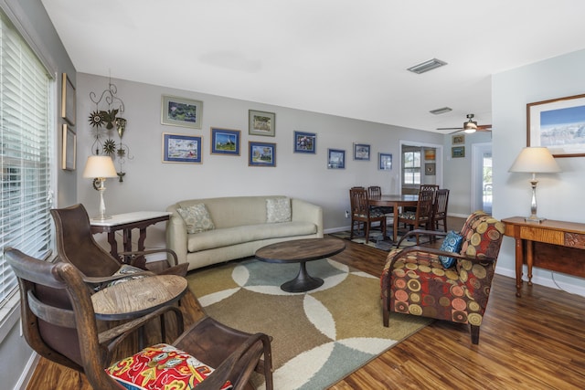 149 SW Grimaldo Ter, Port Saint Lucie, FL 34984 - living area with wood finished floors, a ceiling fan, and baseboards