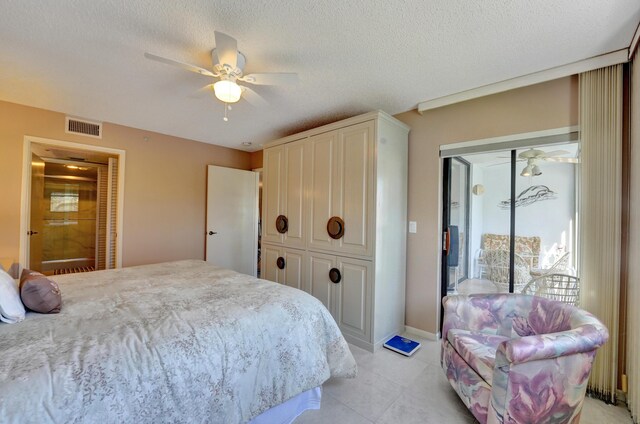 15355 Lakes Of Delray Blvd Unit 211, Delray Beach, FL 33484 - bedroom featuring light tile patterned floors, ceiling fan, and a textured ceiling