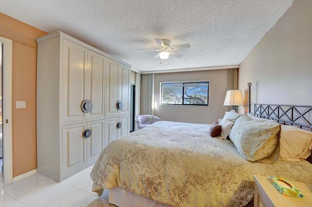 15355 Lakes Of Delray Blvd Unit 211, Delray Beach, FL 33484 - bedroom featuring a textured ceiling, a closet, ceiling fan, and baseboards