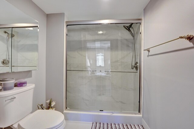 15355 Lakes Of Delray Blvd Unit 211, Delray Beach, FL 33484 - full bathroom featuring toilet and a shower stall