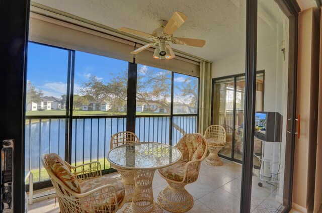15355 Lakes Of Delray Blvd Unit 211, Delray Beach, FL 33484 - sunroom / solarium featuring a water view and tile patterned floors