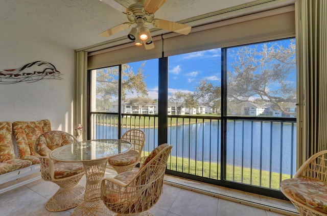 15355 Lakes Of Delray Blvd Unit 211, Delray Beach, FL 33484 - sunroom featuring a water view, tile patterned floors, and plenty of natural light