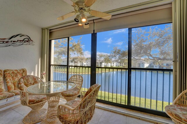 15355 Lakes Of Delray Blvd Unit 211, Delray Beach, FL 33484 - sunroom with a water view, tile patterned flooring, and healthy amount of natural light