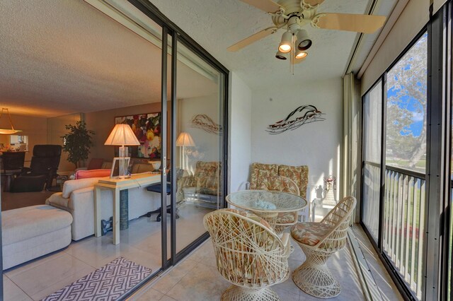 15355 Lakes Of Delray Blvd Unit 211, Delray Beach, FL 33484 - sunroom with a textured ceiling, a ceiling fan, and tile patterned flooring