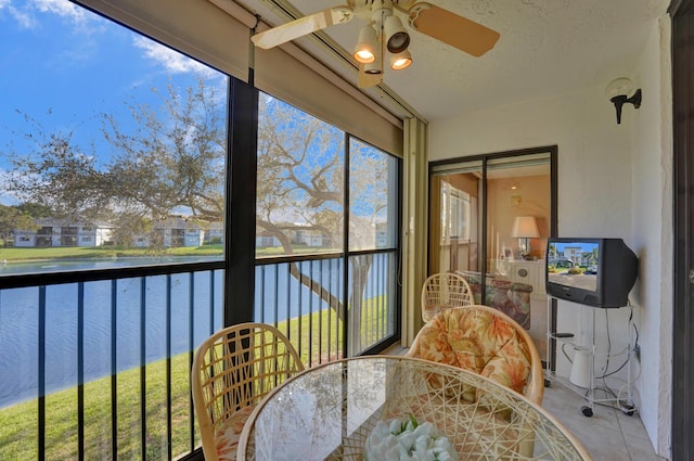 15355 Lakes Of Delray Blvd Unit 211, Delray Beach, FL 33484 - sunroom / solarium featuring outdoor dining area, a ceiling fan, and a water view