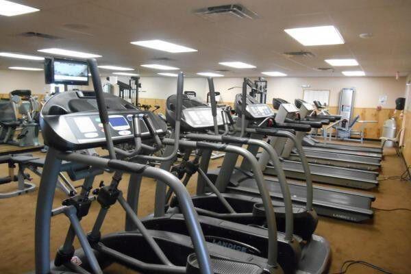 15355 Lakes Of Delray Blvd Unit 211, Delray Beach, FL 33484 - exercise room with carpet flooring