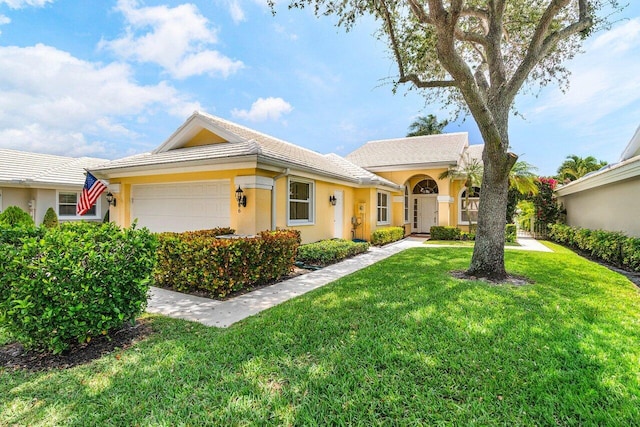 2306 Bear Pt, West Palm Beach, FL 33409 - ranch-style home with stucco siding, a front lawn, and a garage