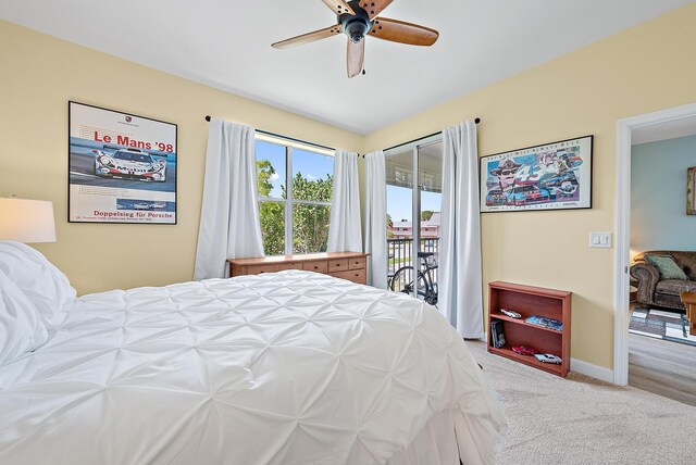 18081 SE Country Club Dr Unit 370, Tequesta, FL 33469 - bedroom featuring access to exterior, carpet, baseboards, and ceiling fan
