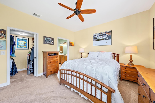 18081 SE Country Club Dr Unit 370, Tequesta, FL 33469 - bedroom featuring light carpet, baseboards, ceiling fan, and ensuite bath