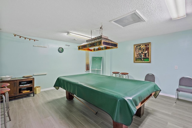 18081 SE Country Club Dr Unit 370, Tequesta, FL 33469 - rec room with light wood finished floors, billiards, baseboards, and a textured ceiling