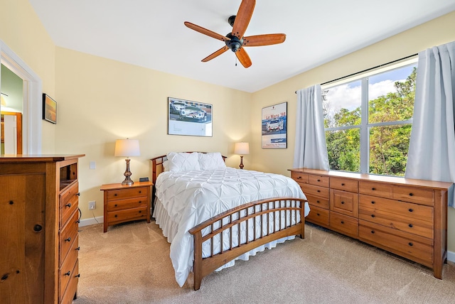18081 SE Country Club Dr Unit 370, Tequesta, FL 33469 - bedroom featuring light carpet, baseboards, and a ceiling fan