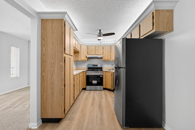 1104 Green Pine Blvd Unit D2, West Palm Beach, FL 33409 - kitchen with appliances with stainless steel finishes, under cabinet range hood, ceiling fan, a textured ceiling, and light countertops