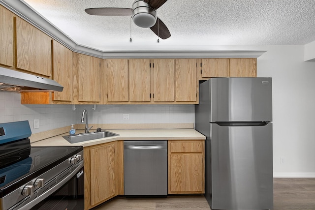 1104 Green Pine Blvd Unit D2, West Palm Beach, FL 33409 - kitchen featuring stainless steel appliances, light countertops, tasteful backsplash, ceiling fan, and a textured ceiling