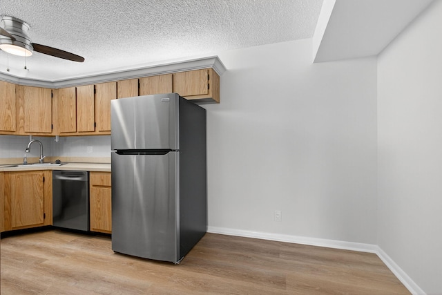1104 Green Pine Blvd Unit D2, West Palm Beach, FL 33409 - kitchen with appliances with stainless steel finishes, light countertops, light wood-style floors, ceiling fan, and a textured ceiling