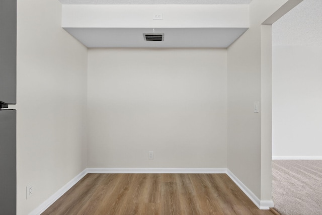 1104 Green Pine Blvd Unit D2, West Palm Beach, FL 33409 - empty room featuring wood finished floors and baseboards