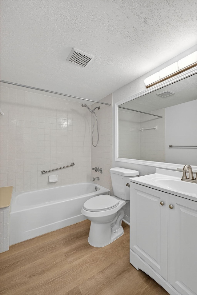 1104 Green Pine Blvd Unit D2, West Palm Beach, FL 33409 - full bathroom with wood finished floors,  shower combination, vanity, and a textured ceiling