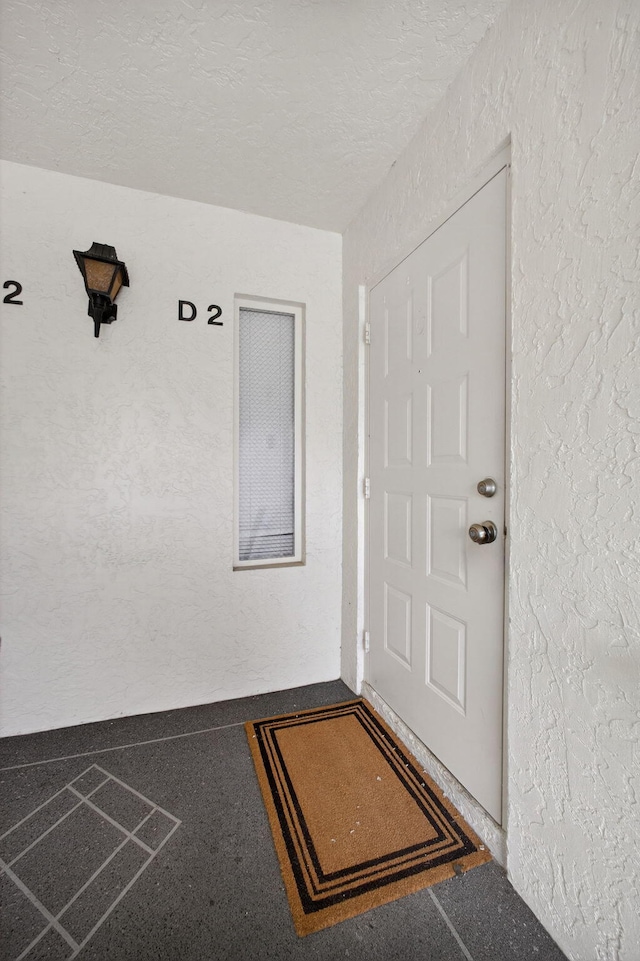 1104 Green Pine Blvd Unit D2, West Palm Beach, FL 33409 - doorway to property with stucco siding