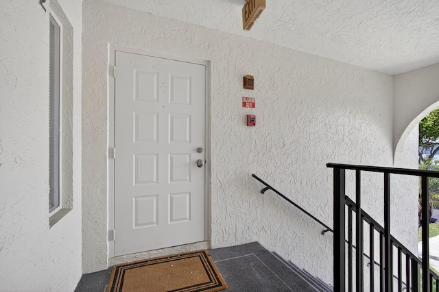 1104 Green Pine Blvd Unit D2, West Palm Beach, FL 33409 - doorway to property featuring stucco siding