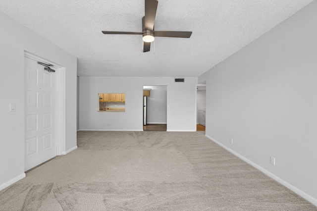 1104 Green Pine Blvd Unit D2, West Palm Beach, FL 33409 - unfurnished bedroom featuring a textured ceiling, carpet flooring, and a ceiling fan