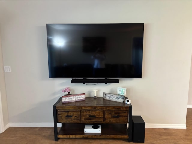 detailed view of baseboards and wood finished floors