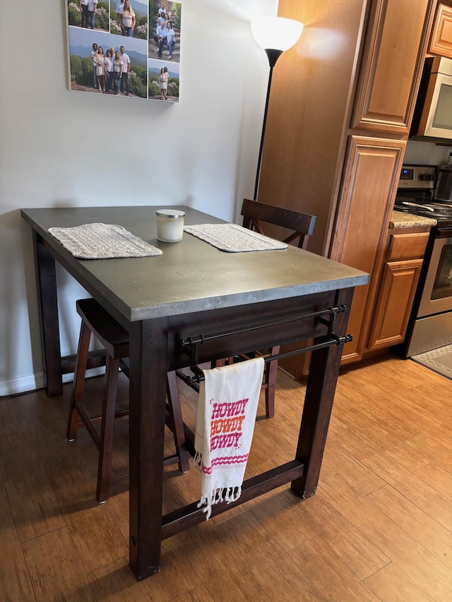dining area featuring light wood-style flooring