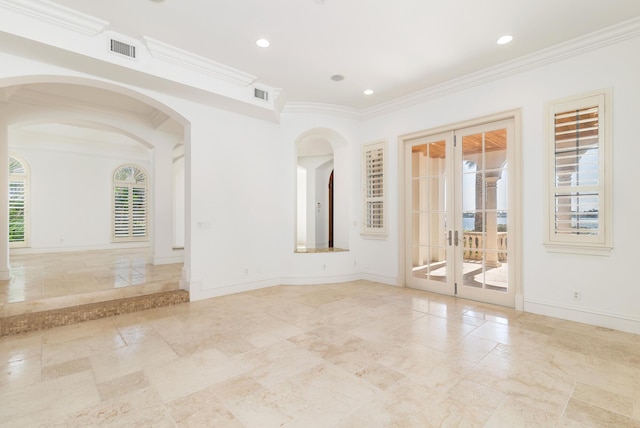 3309 S Flagler Dr, West Palm Beach, FL 33405 - unfurnished room with french doors, baseboards, crown molding, arched walkways, and recessed lighting