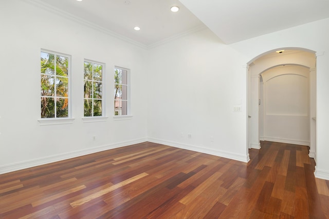 3309 S Flagler Dr, West Palm Beach, FL 33405 - unfurnished room with arched walkways, wood finished floors, recessed lighting, baseboards, and crown molding
