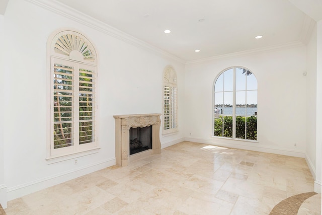 3309 S Flagler Dr, West Palm Beach, FL 33405 - unfurnished living room featuring a high end fireplace, recessed lighting, baseboards, ornamental molding, and light marble finish flooring