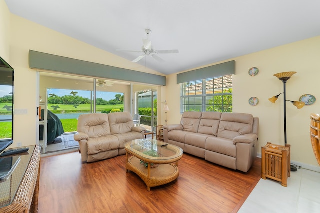 1056 SW Balmoral Trce, Stuart, FL 34997 - living area with a ceiling fan, vaulted ceiling, and wood finished floors