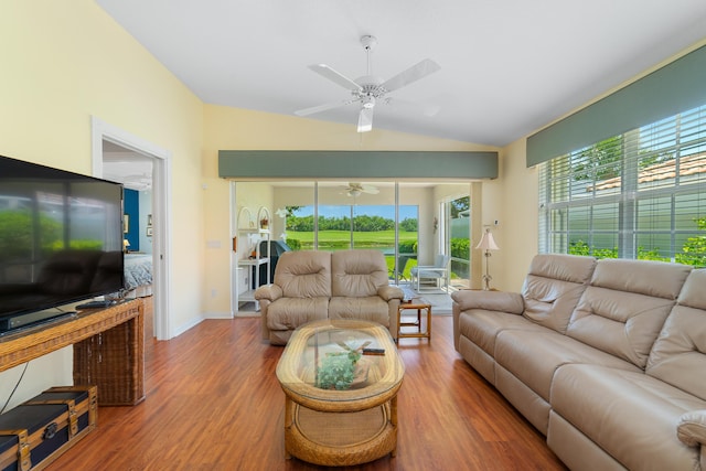 1056 SW Balmoral Trce, Stuart, FL 34997 - living room with lofted ceiling, a ceiling fan, wood finished floors, and healthy amount of natural light