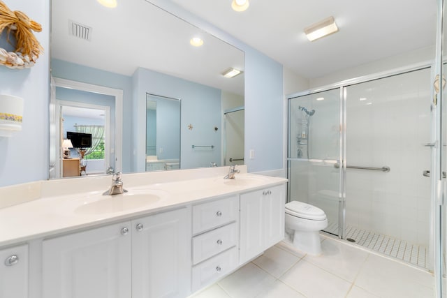 1056 SW Balmoral Trce, Stuart, FL 34997 - full bath featuring toilet, double vanity, a stall shower, tile patterned flooring, and recessed lighting