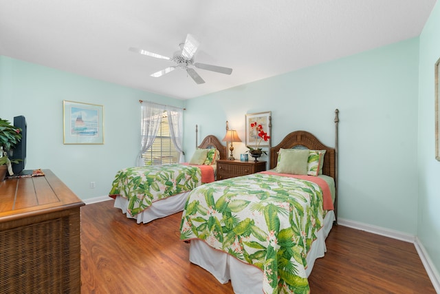 1056 SW Balmoral Trce, Stuart, FL 34997 - bedroom featuring wood finished floors, baseboards, and ceiling fan