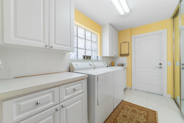 1056 SW Balmoral Trce, Stuart, FL 34997 - laundry area featuring cabinet space, separate washer and dryer, and light tile patterned floors