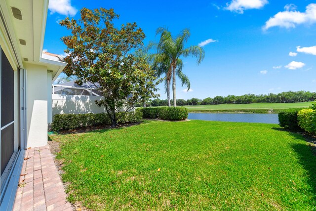 1056 SW Balmoral Trce, Stuart, FL 34997 - view of green lawn featuring a water view