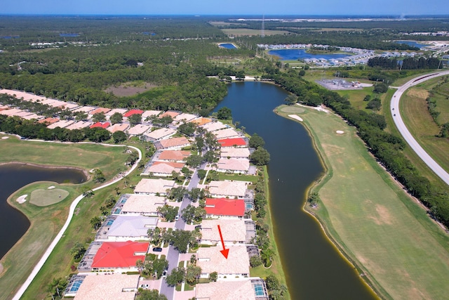 1056 SW Balmoral Trce, Stuart, FL 34997 - aerial view of property's location featuring a large body of water, nearby suburban area, and a local golf course