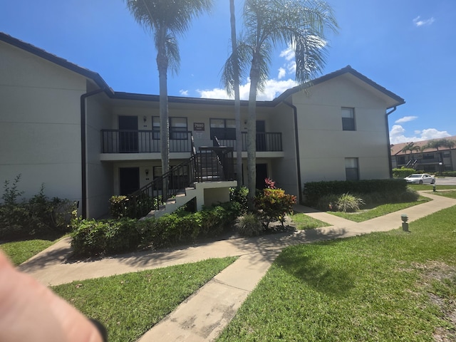 7690 Tahiti Ln Unit 202, Lake Worth, FL 33467 - view of building exterior featuring stairs