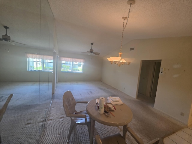 7690 Tahiti Ln Unit 202, Lake Worth, FL 33467 - dining room featuring a ceiling fan, light carpet, vaulted ceiling, and a textured ceiling