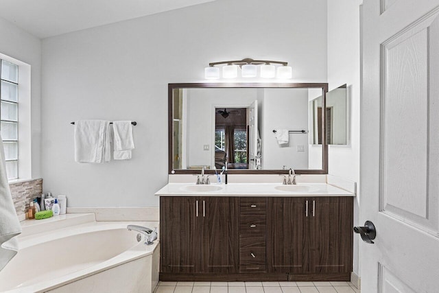 5350 Casa Real Dr, Delray Beach, FL 33484 - bathroom featuring double vanity, a bath, and tile patterned floors
