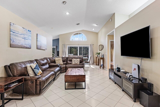 5350 Casa Real Dr, Delray Beach, FL 33484 - living room with vaulted ceiling, light tile patterned floors, and a textured ceiling