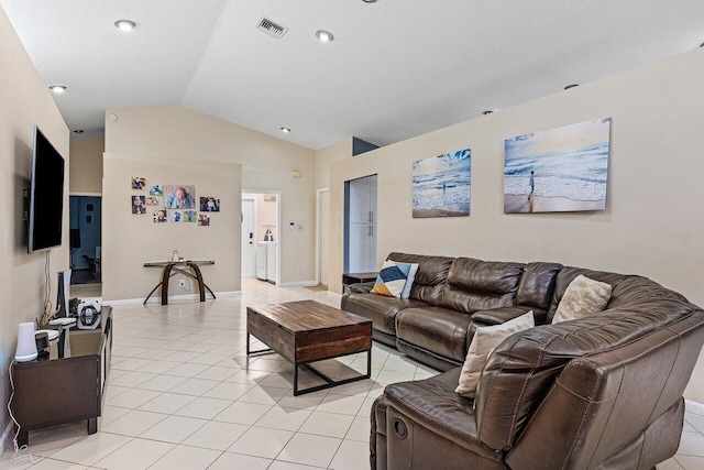 5350 Casa Real Dr, Delray Beach, FL 33484 - living area with vaulted ceiling, light tile patterned floors, baseboards, and a textured ceiling