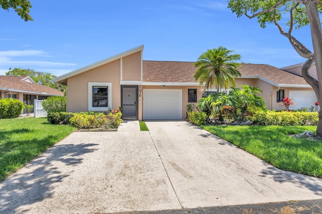 8076 Sweetbriar Way, Boca Raton, FL 33496 - mid-century inspired home featuring stucco siding, a garage, a front lawn, concrete driveway, and roof with shingles