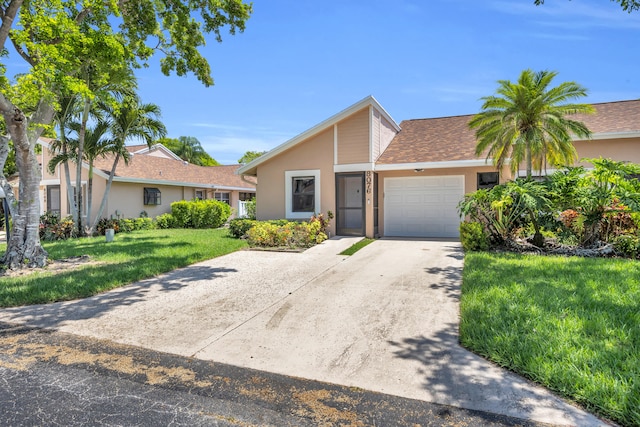 8076 Sweetbriar Way, Boca Raton, FL 33496 - mid-century home featuring driveway, an attached garage, stucco siding, a front lawn, and a shingled roof
