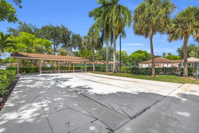 8076 Sweetbriar Way, Boca Raton, FL 33496 - view of property's community featuring a carport and concrete driveway