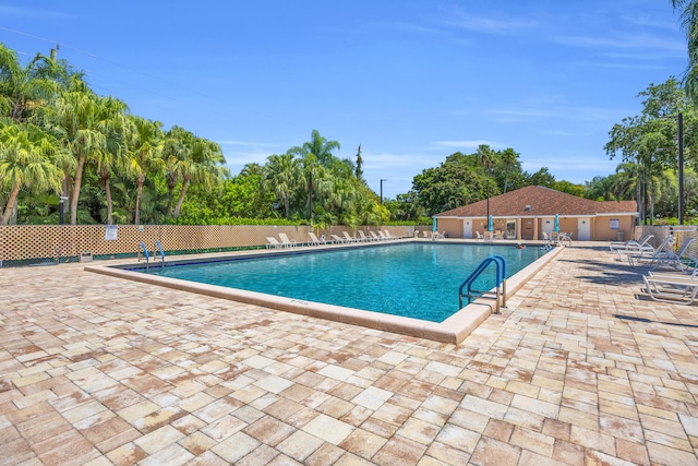 8076 Sweetbriar Way, Boca Raton, FL 33496 - community pool featuring a patio and view of scattered trees